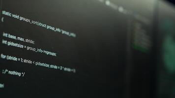 Extreme close up shot of lines of code displayed on computer monitors used by cybercriminal stealing sensitive information. Virus scripts running on PC infecting network systems, breaking passwords photo