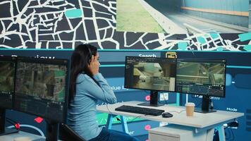 Indian call center operator gives order delivery updates to clients, handling shipment delay complains in control center. Cargo shipping agency directing trucks on less busy routes. Camera B. photo