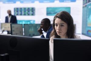Company employee establishing project details and essential information about achieving business objectives, allocating budget and other resources. Strategic projection on pc. photo