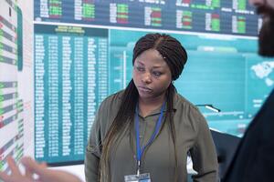 General manager and CEO sharing insight about a new development strategy with data on a big screen, presenting annual infographics to analyze business activity status. Investors team. photo