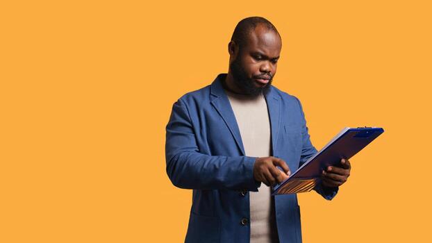 Accountant doing profit analysis for company, browsing files, isolated over studio background. Worker doing financial budgeting and forecasting, complaining about financial figures, camera B photo