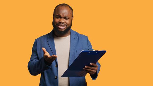 Accountant doing profit analysis for company, browsing files, isolated over studio background. Worker doing financial budgeting and forecasting, complaining about financial figures, camera A photo
