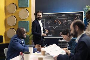 Financial group working on ways to obtain capital from stakeholders, creating an interactive presentation to explain resources allocation. Accounting team following market trends and data. photo