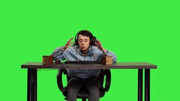 POV woman getting frustrated about losing online gaming tournament, playing games sitting at desk. Player feeling furious and disappointed with her failure, greenscreen backdrop. Camera B. photo