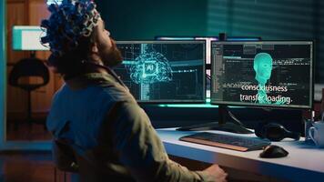 Programmer using EEG headset to upload his mind into computer, attaining immortality. Neuroscientist experimenting with transferring consciousness into cyberspace, camera A photo