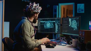 Computer scientist putting EEG headset on, starting mind upload process, trying to gain bionic powers. Man using high tech neuroscientific gear to transfer consciousness into cyberspace, camera B photo