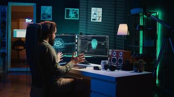 Man programing sentient artificial intelligence with ethical safeguards against turning evil towards humanity, creation myth concept. Developer building conscious AI superintelligence, camera B photo