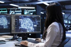 Engineer working in data center providing computing resources needed for artificial intelligence to process massive datasets for training. Woman in server room storing data used for machine learning photo
