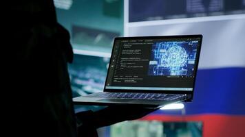 Russian IT expert uses new technology machine learning to spread fake news and cyber war propaganda, making national threats via neural network digital science. Army stealing information. Camera A. photo
