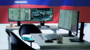 Empty military command center drone control agency with the russian flag on big screen, spreading misinformation and fake news to scare the population. Russian federation army. Camera A. photo