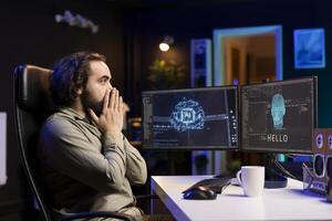 Programmer shocked by awaken AI gaining consciousness on computer. Surprised man communicating with artificial intelligence through desktop PC, astonished by engineering feat photo