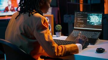 African american girl uses artificial intelligence software for machine learning and cloud computing, terminal window programming language. IT student studying deep learning AI hardware. Camera A. photo