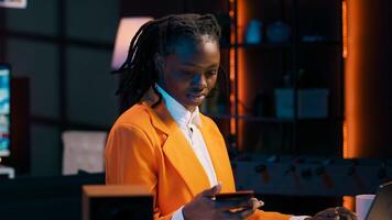 Young woman entering credit card credentials or digital password on website, enjoying online shopping. Girl typing bank transfer numbers and selecting the delivery method, order clothes. Camera A. photo