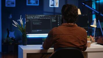 Remote software developer arriving in personal office at home, starting job shift with cup of coffee. Teleworker enjoying hot beverage while writing lines of code on computer, camera A photo