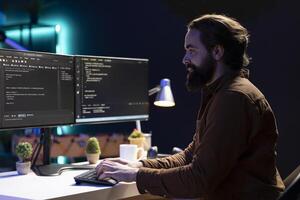 Freelancing computer engineer typing on keyboard, implementing security measures to protect company systems and data. Remote IT worker testing and debugging code for software applications photo