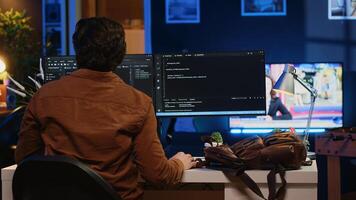 Remote software developer arriving in personal office at home, resuming work on javascript programming. IT engineer starting job shift in apartment, writing lines of code on computer photo