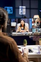 Engineer doing company software debugging, talking with management in videocall about errors found in code. IT worker sharing coding mistakes found with board of directors in online teleconference photo