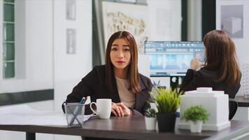 POV of contractor meeting with client on videocall to explain her architectural vision and remodeling costs. Expert engineer presenting layout sketch plans for their home, online call network. photo