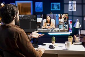 Developer doing online tutoring, talking with students in online videocall about ways to do debugging. IT specialist teaching trainees in videoconference how to fix coding mistakes photo
