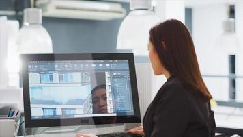 Creative developer designing building models on 3d software, working on creating construction layout at workstation. Woman undergoing architecture task with cad program, startup agency. photo