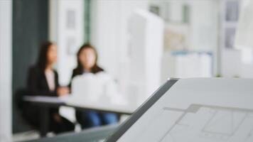 Specialists at creative agency gather data on plans and determine real scale dimensions to guarantee that the building crew gets correct items. Architects researching 3D printed structures. photo