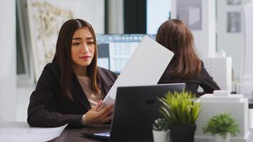 Building engineer on videocall with technician to ensure suitable design elements, working with architectural crew to help with lines and manufacturing scale. Woman chatting on online teleconference. photo