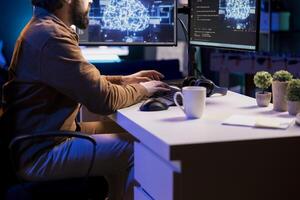 Freelancing computer engineer doing maintenance on artificial intelligence neural networks computerized model. Remote tech support specialist at working from home, doing checkup on AI systems photo