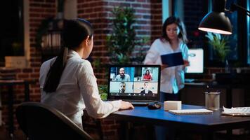 Manager organizing company meeting on videocall, discussing with employees working remotely from home. Team leader talking in corporate remote videoconference telework call with workers photo