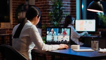 Staff member discussing with members of board of directors during company meeting on videocall. Worker talking in corporate remote videoconference telework call, presenting ideas photo