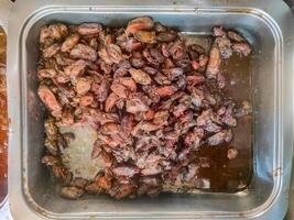 A plate of seasoned and stir fried shellfish, a popular seafood dish from Madura, Indonesia. photo