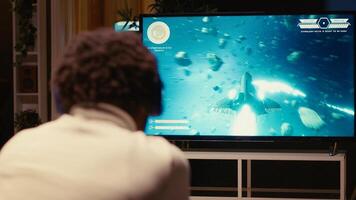 Gamer winning after destroying all enemy spacecrafts and finishing last level in science fiction flying game. Player victorious in singleplayer videogame after defeating boss and saving galaxy photo