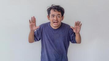 Adult male model with a surprised expression, isolated on a white background. Ideal for themes related to emotions, reactions, surprise, and unexpected events. photo