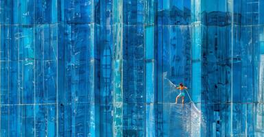 Worker cleaning windows on a high-rise building.Generated image photo