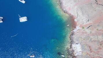 Eagle's eye view of the volcano coasts of Santorini island in Greece video