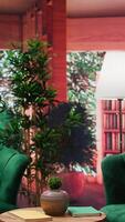 Vertical Stylish empty lounge area with elegant green furniture and wooden table. Natural light fills the space, creating a cozy atmosphere. Panoramic view of trees, rural lifestyle with cute design. video