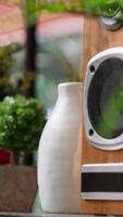 Vertical Elegant decorations and objects on modern shelves in empty cottage space with cozy green furniture and warm light. Contemporary interior design for a Scandinavian style house, natural light. video