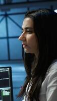 Vertical Admin does maintenance on server hub to optimize it for data processing requirements of artificial intelligence workloads. Expert inspects data center used for machine learning, camera A video