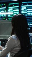 Vertical Team of programmers in data center responsible for installation and repair of networking equipment solving tasks. Teamworking colleagues doing maintenance on server room infrastructure, camera A video