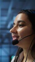 Vertical IT expert in data center provides technical support to customers, troubleshooting issues, close up. Server room employee carrying out operational technical interventions requested by clients, camera B video