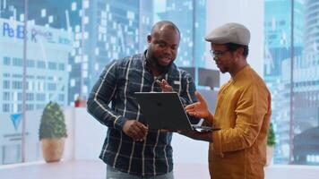 Entrepreneurs sharing their workspace vision with the broker, evaluating architectural blueprints for a new office space in high class urban building. Potential investment in property. Camera B. video