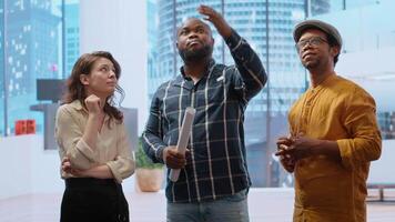 Broker and client sharing a development vision for the new office space in a high class urban building, realtor working with entrepreneur to negotiate a property leasing contract. Camera B. video