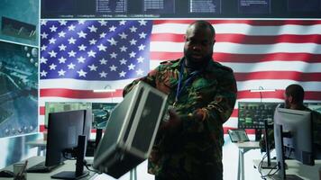 American military officers in cyber command center protect state secrets, manage classified information and engage in high tech digital warfare to ensure cybersecurity and data protection. Camera B. video