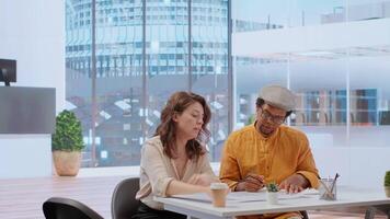 Real estate brokers meeting with client to reach an agreement for property leasing contract, evaluating urban property blueprints and negotiating terms for a high class corporate building. Camera B. video