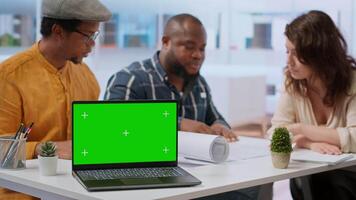 Realtors team presenting office space layout next to copy space mockup, examining blueprints with the client. Real estate agents working on securing a leasing contract, rental agreement. Camera B. video