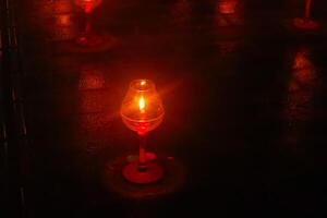 A candle is are lit at borobudur temple. symbol of hope photo