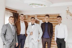 A group of men are dressed in suits and ties, posing for a photo. Scene is formal and professional photo