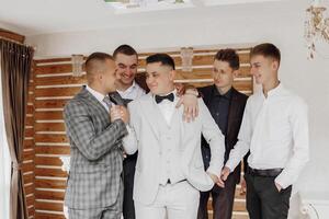A group of men are dressed in suits and ties, posing for a photo. Scene is formal and professional photo