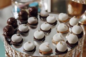 A tray of assorted desserts, including cookies and cakes photo