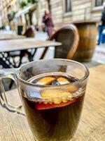 Mulled wine with oranges and cinnamon photo