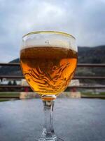 Photo of a glass of beer. Draft beer